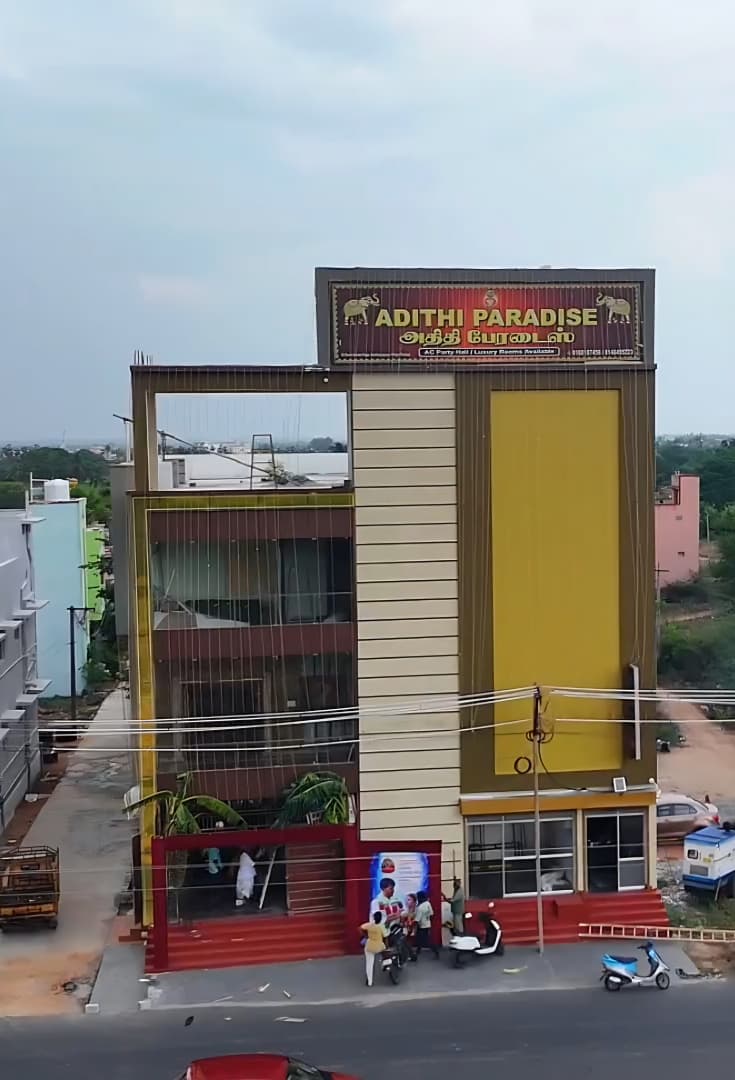 Adithi Paradise building exterior with signage in Karthikeyapuram, Tiruttani